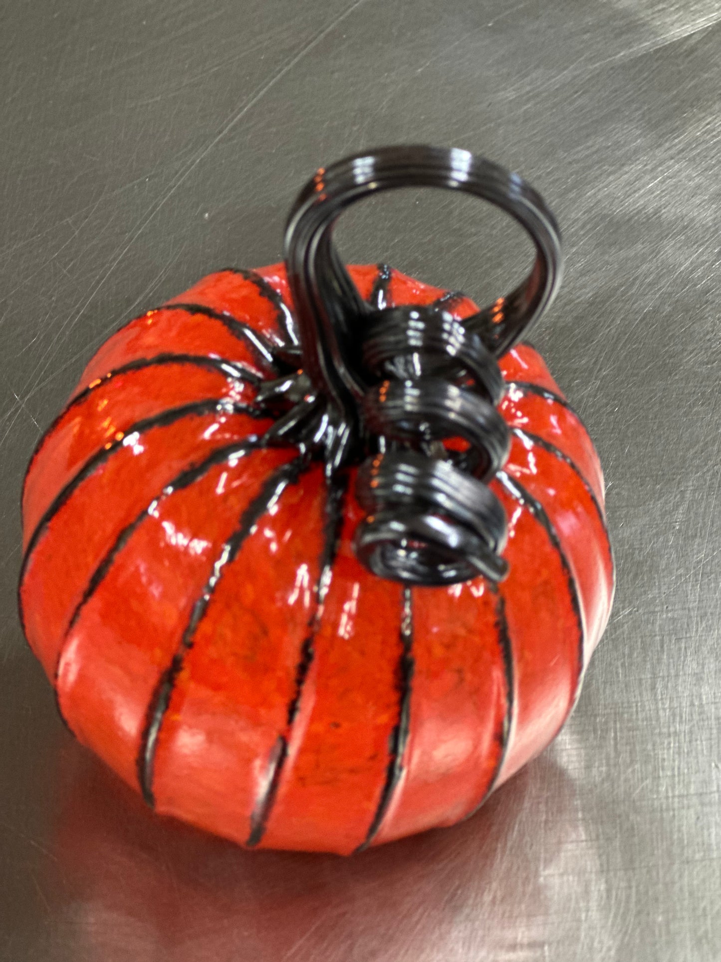 101 Orange and black glass pumpkin.