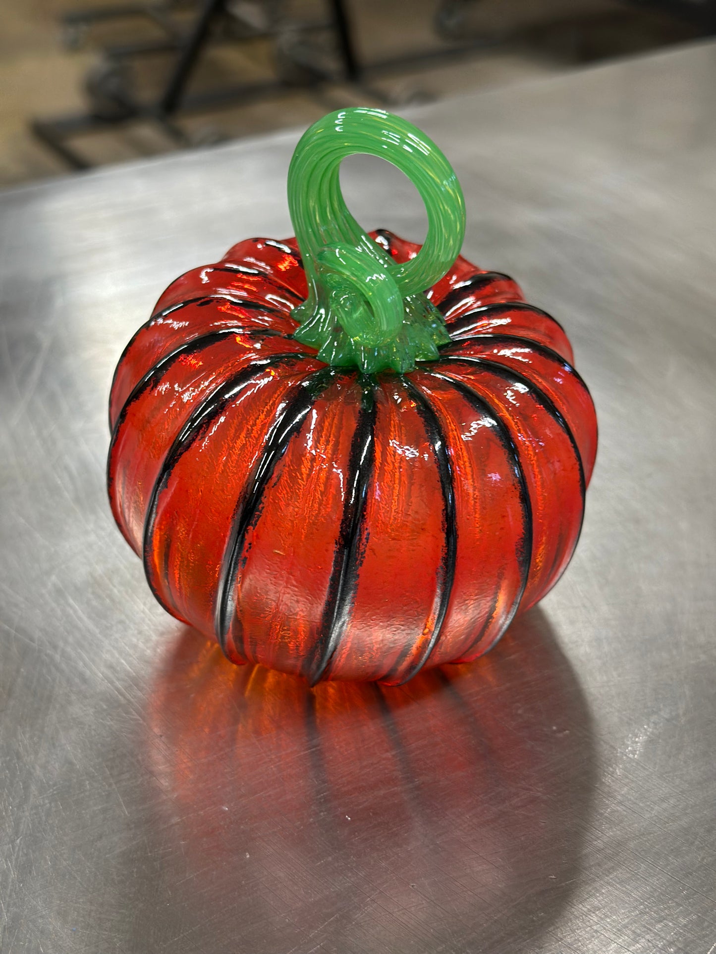 102 Transparent \orange and black glass pumpkin.