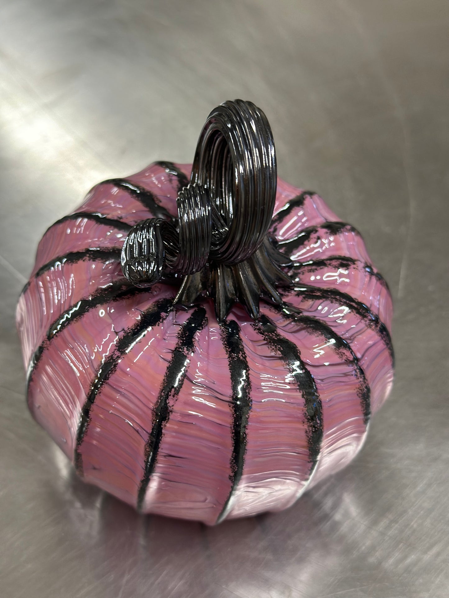 104 Pink and black glass pumpkin.