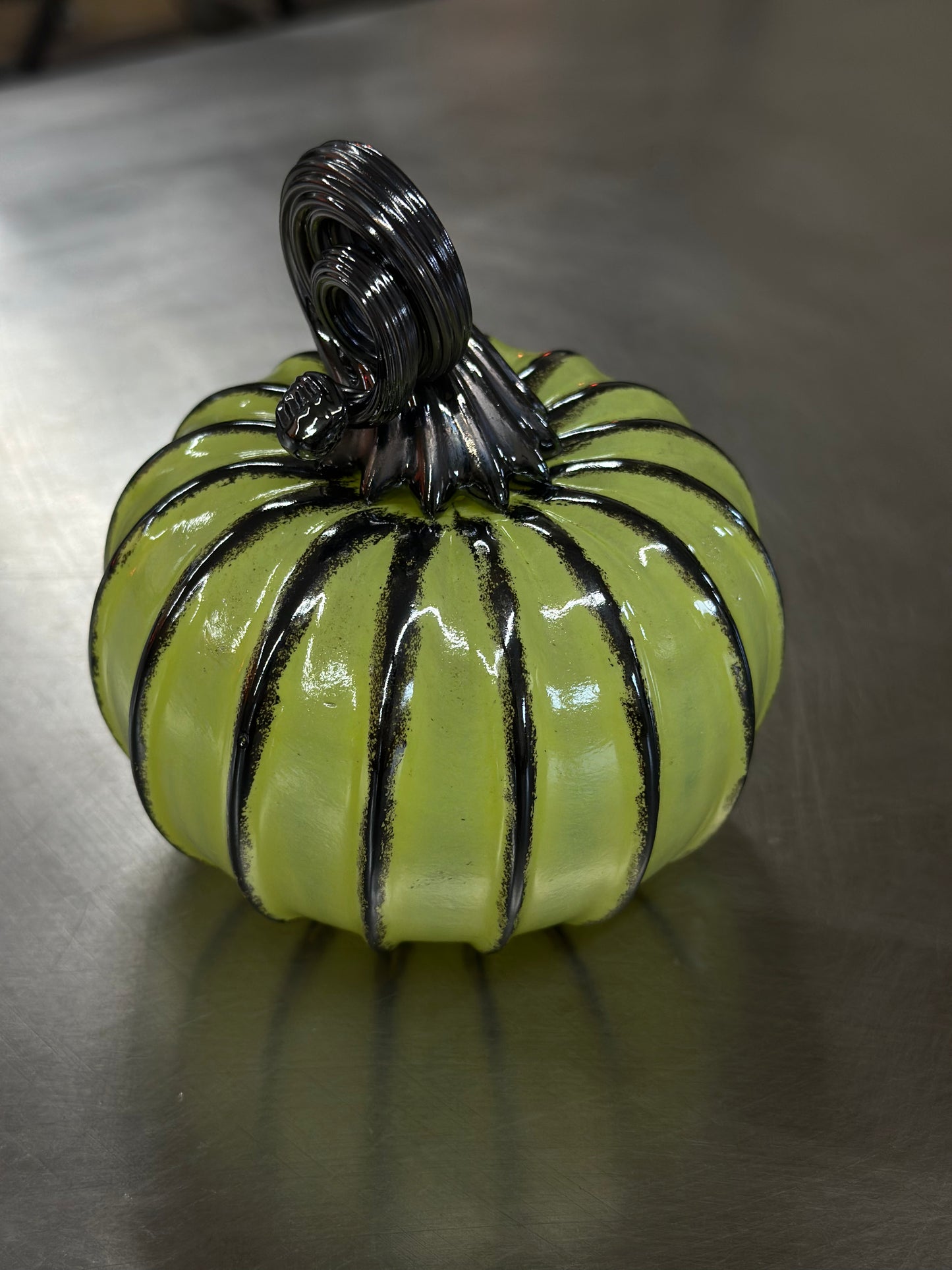 106 Apple green and black glass pumpkin.