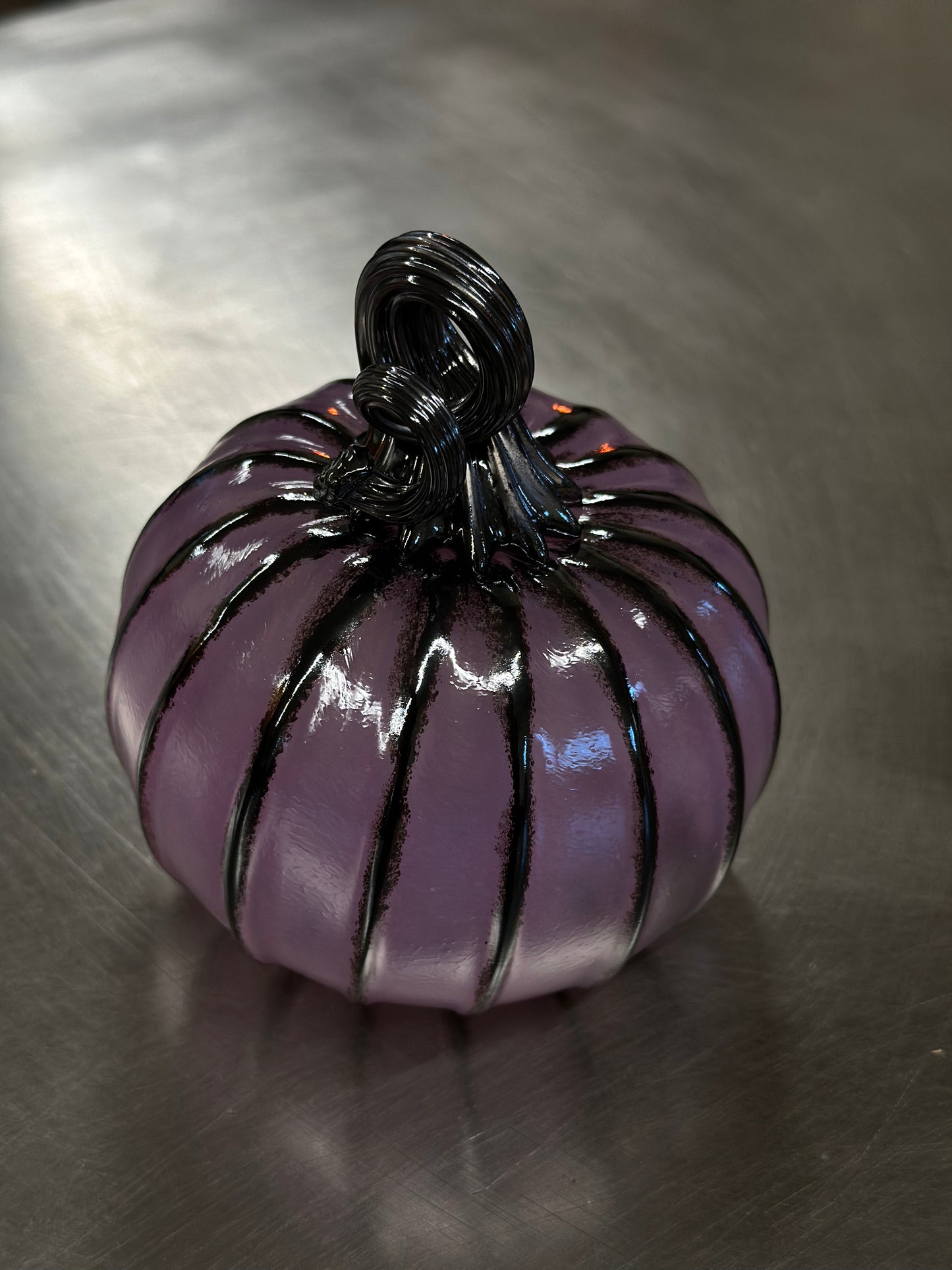 107 Purple and black glass pumpkin.