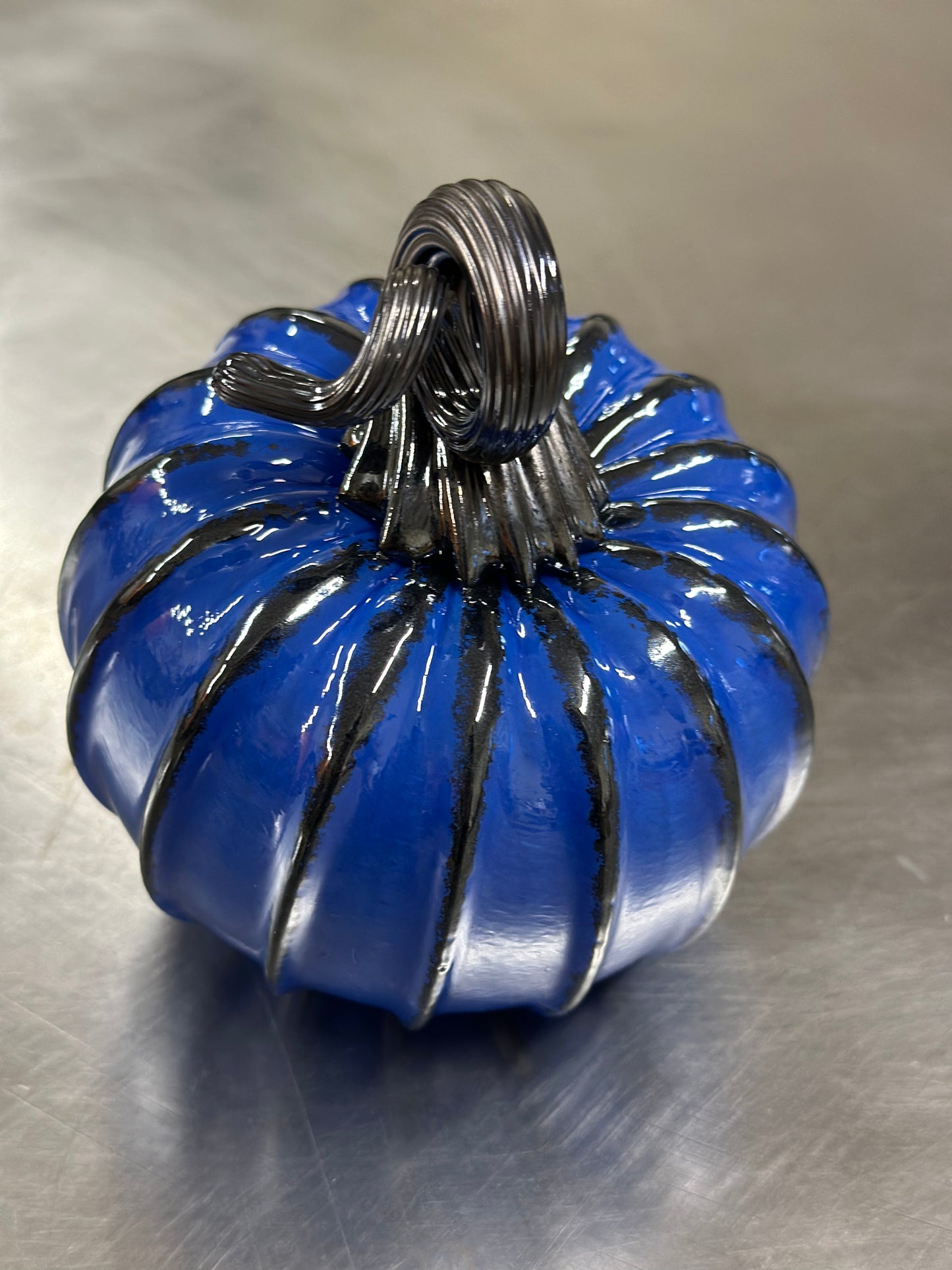 114 Rich blue and black glass pumpkin.
