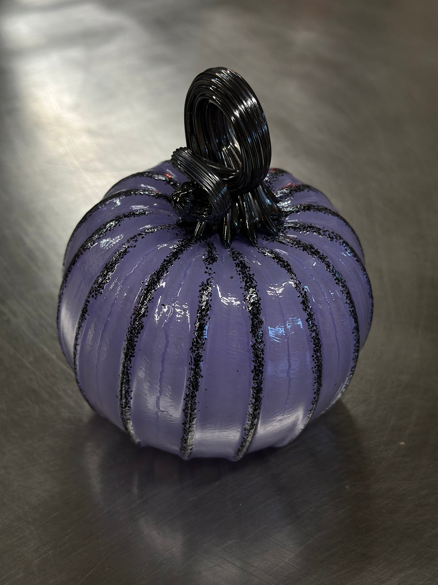 115 Plumb and black glass pumpkin.