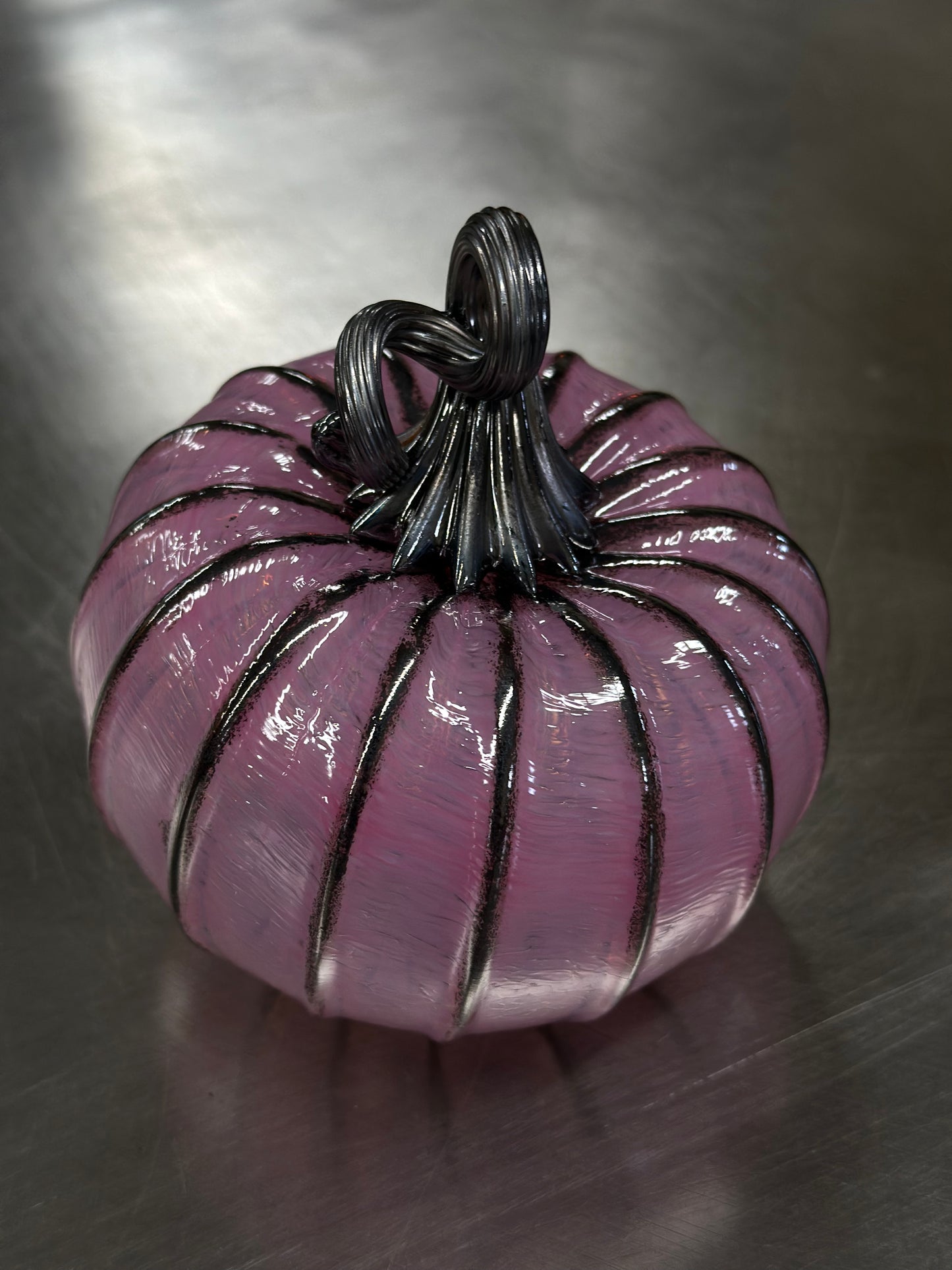 123 Pink and black glass pumpkin.