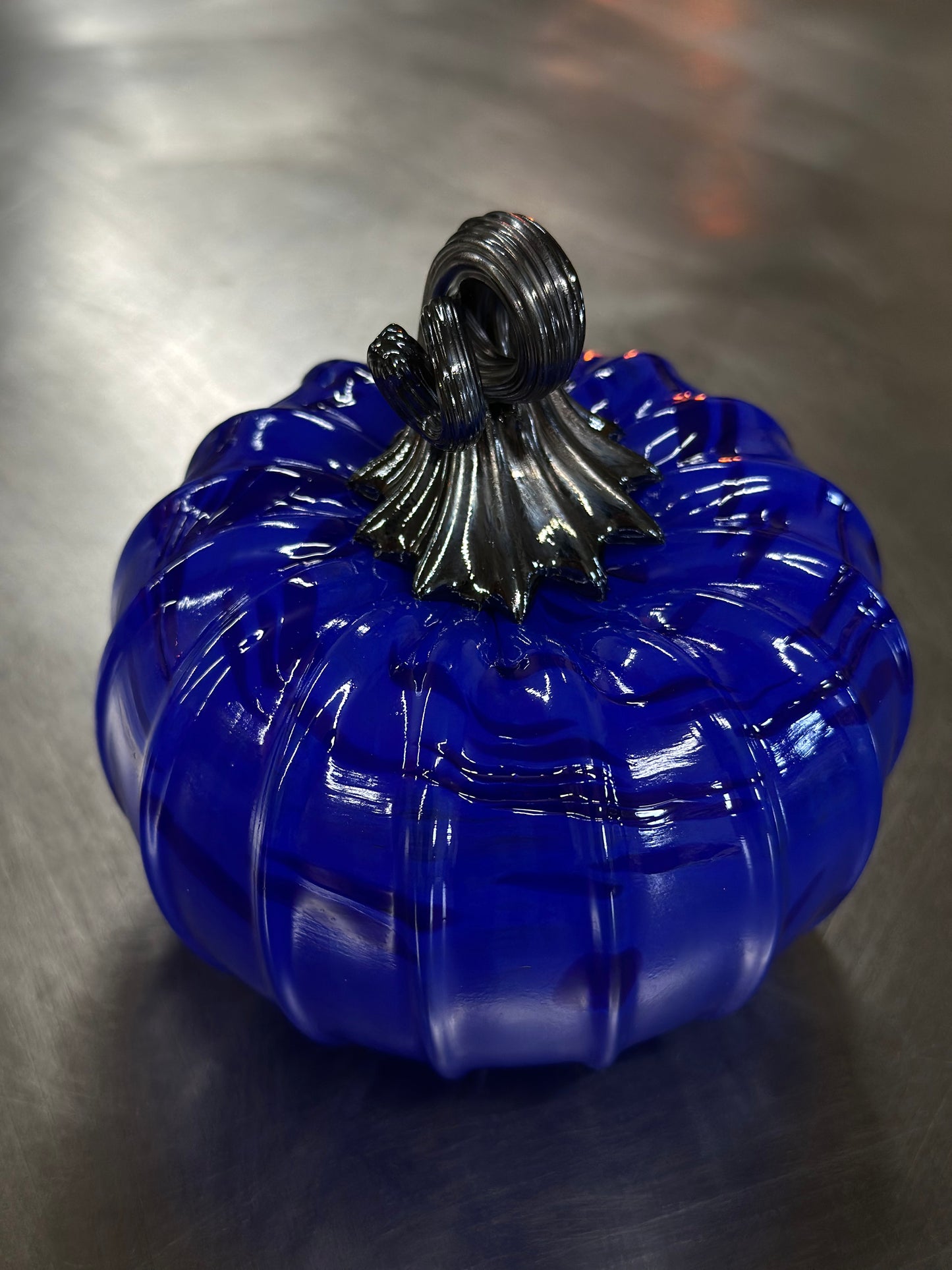 131 Blue on blue and black glass pumpkin.