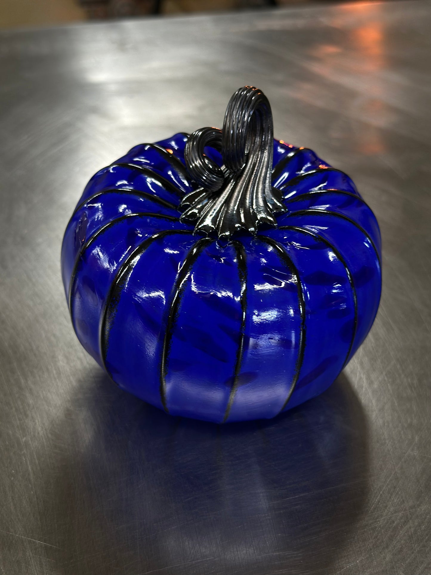 132 Blue on blue and black glass pumpkin.
